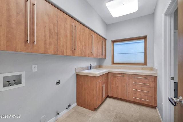 clothes washing area with sink, cabinets, electric dryer hookup, washer hookup, and hookup for a gas dryer