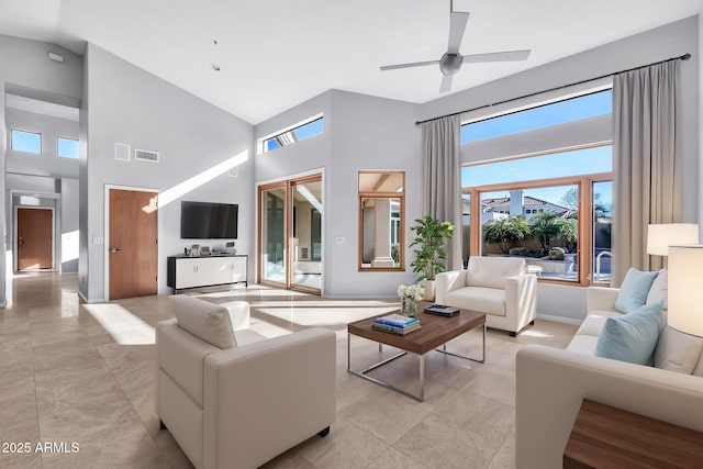 living room with ceiling fan and high vaulted ceiling