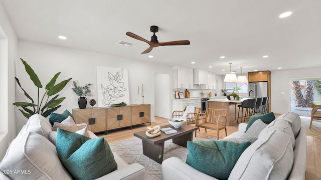 5109 E Blanche Dr, Scottsdale, AZ 85254 - living room featuring recessed lighting, light wood-type flooring, and a ceiling fan