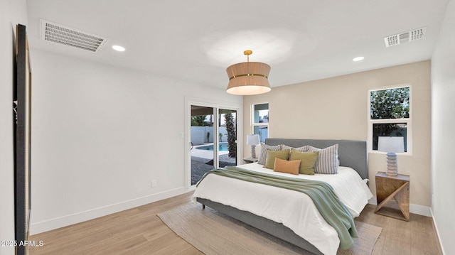5109 E Blanche Dr, Scottsdale, AZ 85254 - bedroom with access to outside, multiple windows, baseboards, light wood-style floors, and recessed lighting