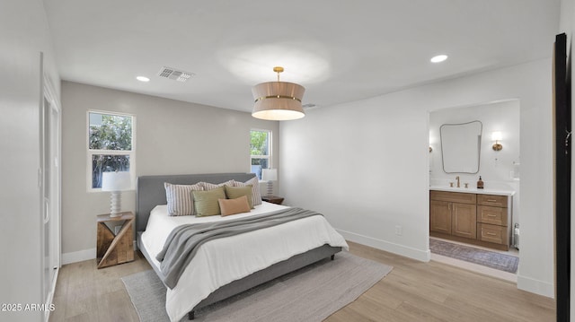 5109 E Blanche Dr, Scottsdale, AZ 85254 - bedroom featuring a sink, light wood-style floors, baseboards, recessed lighting, and ensuite bathroom
