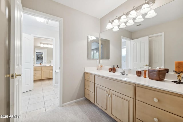 bathroom with tile patterned floors and vanity