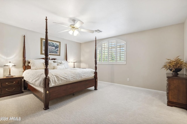 bedroom with ceiling fan and light colored carpet