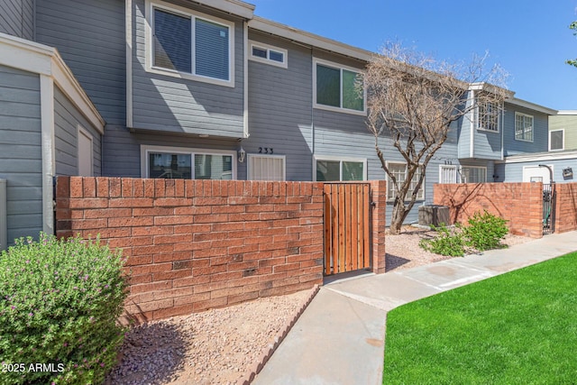 2301 E University Dr Unit 233, Mesa, AZ 85213 - exterior space with a gate, fence, and central AC unit