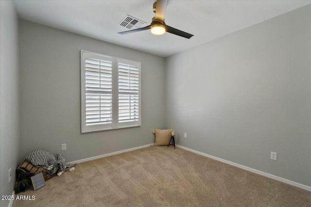 carpeted empty room featuring ceiling fan