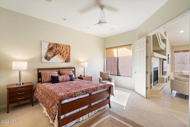 bedroom with light colored carpet and ceiling fan