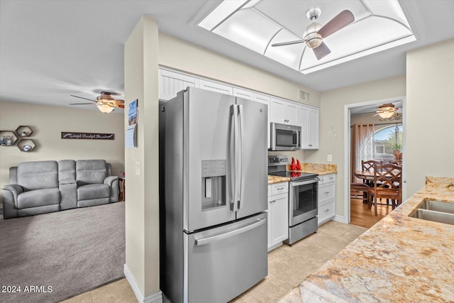 kitchen featuring white cabinetry, appliances with stainless steel finishes, and ceiling fan