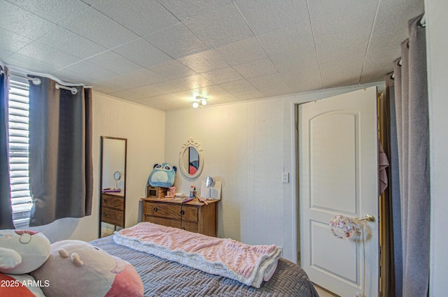 bedroom with multiple windows