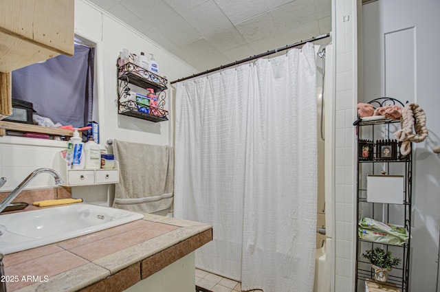 bathroom featuring vanity and shower / tub combo with curtain