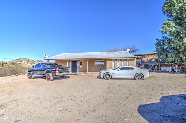 view of front facade featuring stucco siding