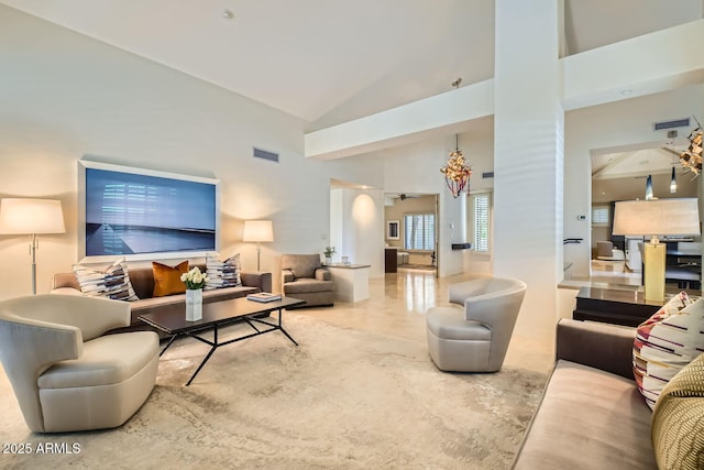 living room featuring high vaulted ceiling