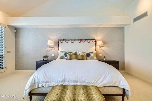 bedroom featuring vaulted ceiling and carpet flooring