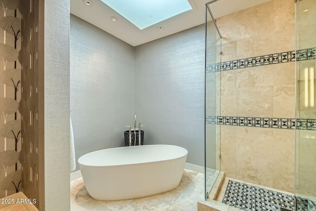 bathroom with separate shower and tub and a skylight