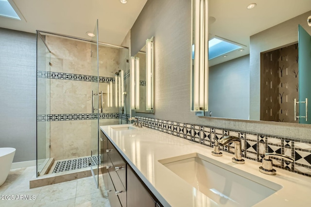 bathroom featuring tile patterned flooring, backsplash, vanity, and separate shower and tub