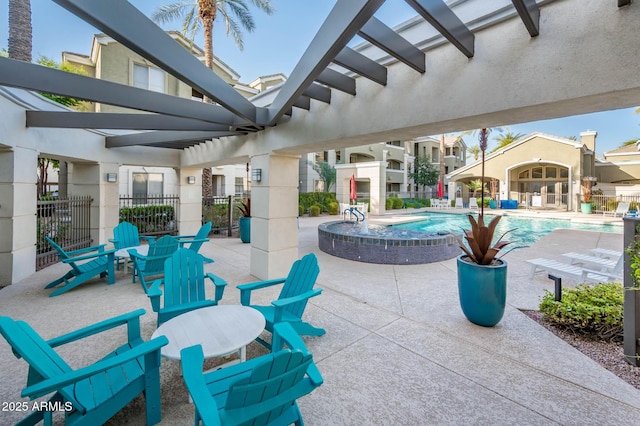 view of patio / terrace featuring a community pool, fence, and a pergola