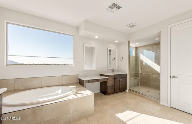 bathroom featuring separate shower and tub, tile patterned floors, and vanity