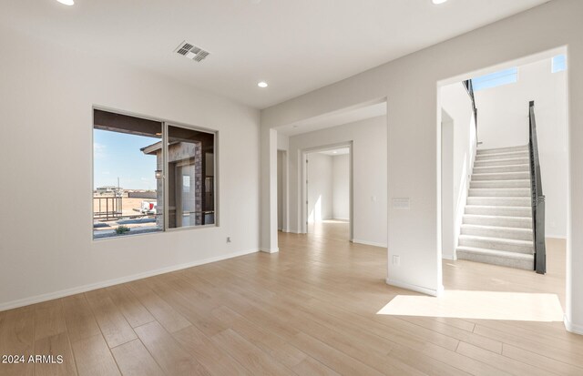 spare room with light hardwood / wood-style floors