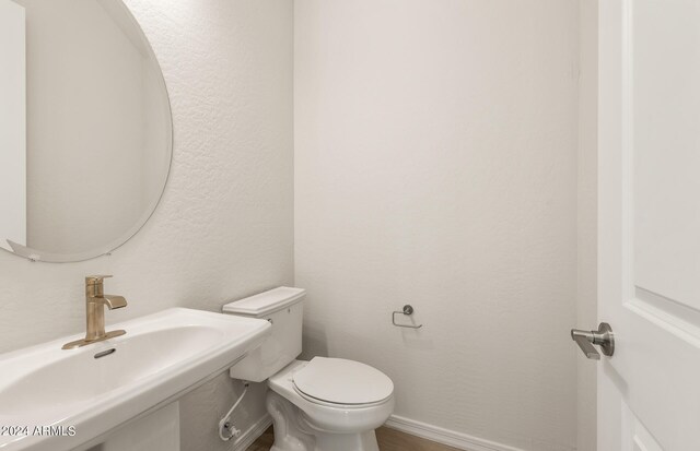 bathroom with sink and toilet