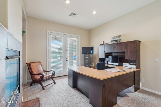 home office with visible vents, baseboards, recessed lighting, french doors, and light colored carpet