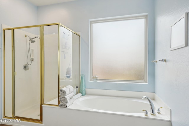 full bath with a garden tub and a shower stall