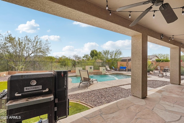 exterior space with a fenced in pool, a fenced backyard, and ceiling fan