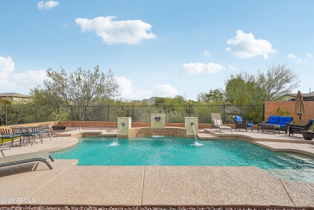 view of pool featuring a fire pit, fence, and a patio
