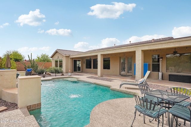 view of pool with fence, a patio, french doors, and a fenced in pool