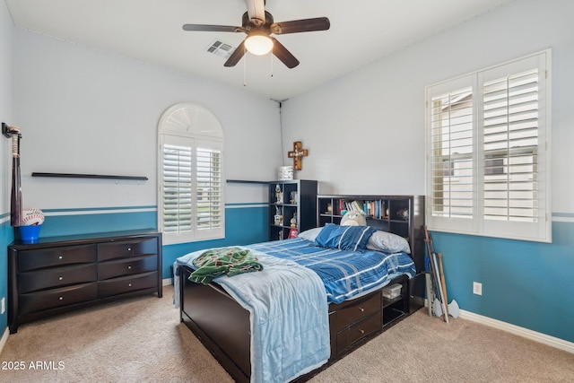 bedroom with carpet, baseboards, ceiling fan, and visible vents