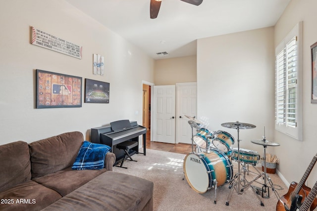 playroom with a ceiling fan, carpet, baseboards, and visible vents