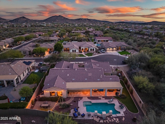aerial view at dusk with a residential view and a mountain view