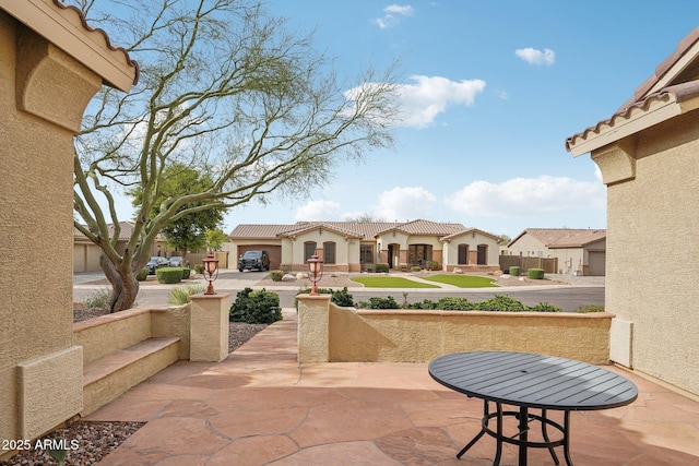 view of patio with a residential view