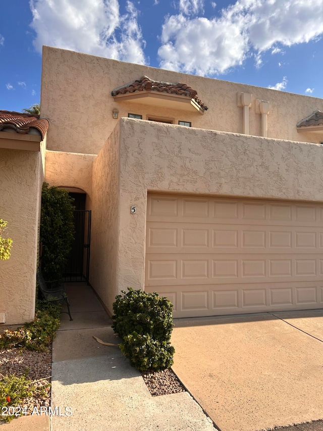 exterior space with a garage