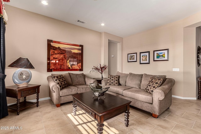 living room with light tile patterned flooring