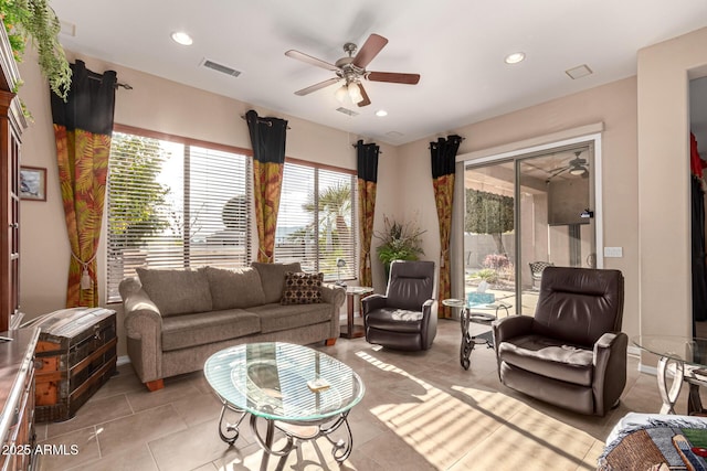 living room with light tile patterned flooring and ceiling fan