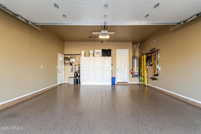 garage with a garage door opener and gas water heater