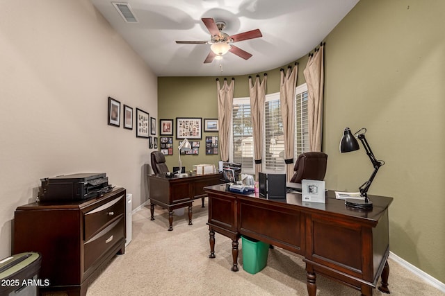 carpeted office featuring ceiling fan