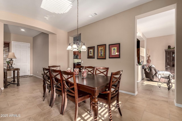 dining room with a notable chandelier