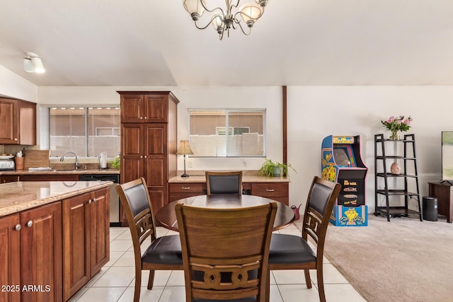4441 E Desert Wind Dr, Phoenix, AZ 85044 - dining space featuring a chandelier, light tile patterned floors, and light carpet