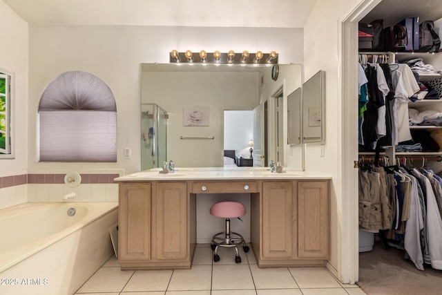 4441 E Desert Wind Dr, Phoenix, AZ 85044 - full bath with a stall shower, a bath, tile patterned flooring, vanity, and a spacious closet