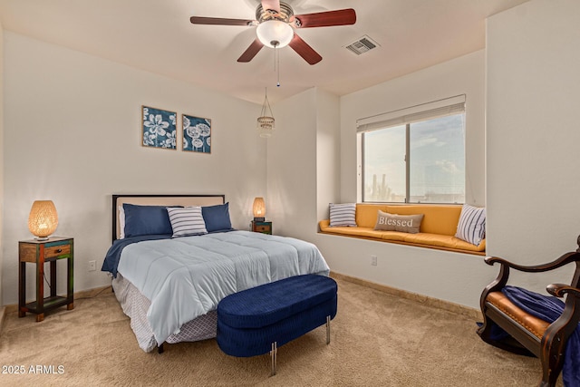 bedroom featuring light carpet and ceiling fan