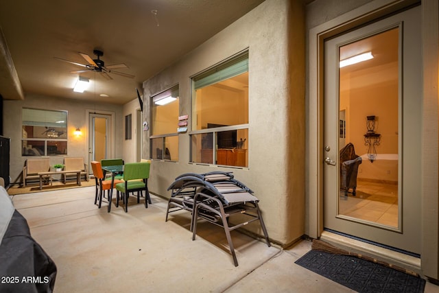 view of patio featuring ceiling fan