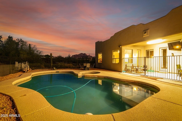 view of swimming pool with a patio and an in ground hot tub