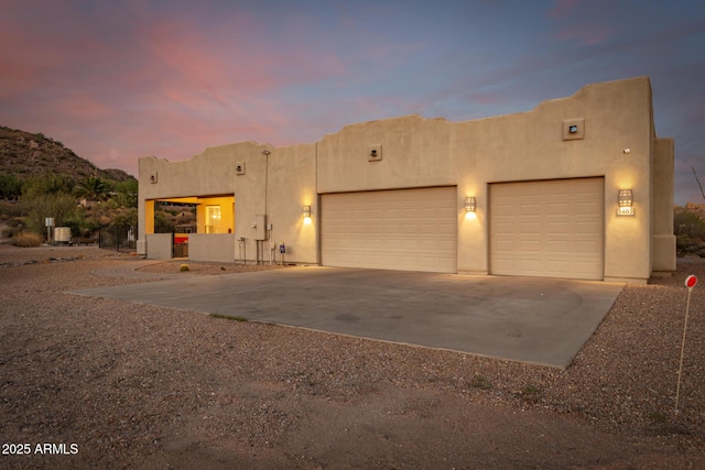 southwest-style home with a garage