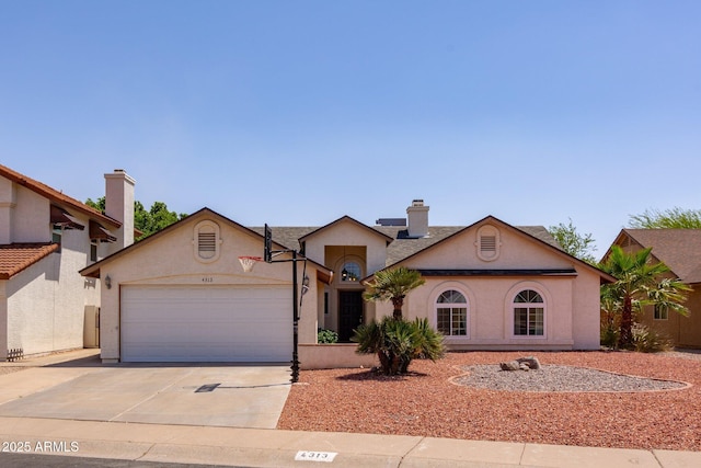 4313 E Briarwood Ter, Phoenix, AZ 85048 - view of front of house featuring an attached garage, driveway, and stucco siding