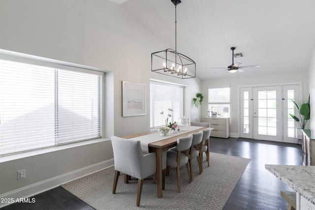 4313 E Briarwood Ter, Phoenix, AZ 85048 - dining space featuring baseboards, a ceiling fan, dark wood-style floors, high vaulted ceiling, and a chandelier