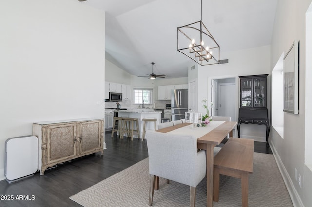 4313 E Briarwood Ter, Phoenix, AZ 85048 - dining space featuring a ceiling fan, high vaulted ceiling, a chandelier, and dark wood finished floors