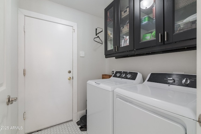 4313 E Briarwood Ter, Phoenix, AZ 85048 - laundry room featuring cabinet space, washing machine and dryer, and light tile patterned floors