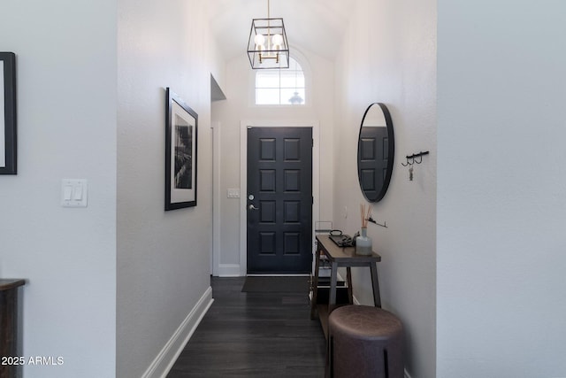 4313 E Briarwood Ter, Phoenix, AZ 85048 - entryway featuring baseboards, dark wood-style flooring, lofted ceiling, and a chandelier