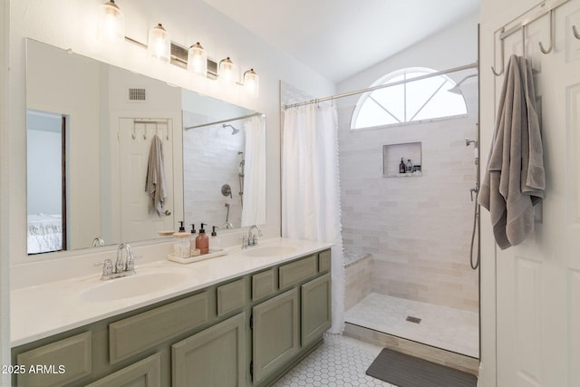 4313 E Briarwood Ter, Phoenix, AZ 85048 - bathroom with a tile shower, double vanity, and tile patterned flooring