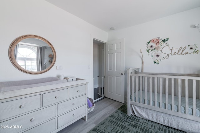 4313 E Briarwood Ter, Phoenix, AZ 85048 - bedroom with wood finished floors and a nursery area